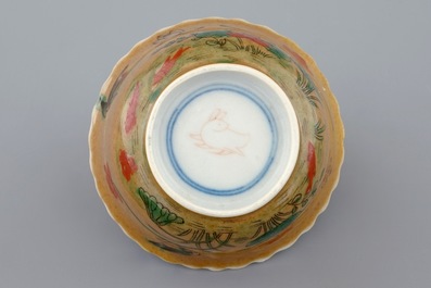 A Chinese famille verte and caf&eacute; au lait cup and saucer, Kangxi